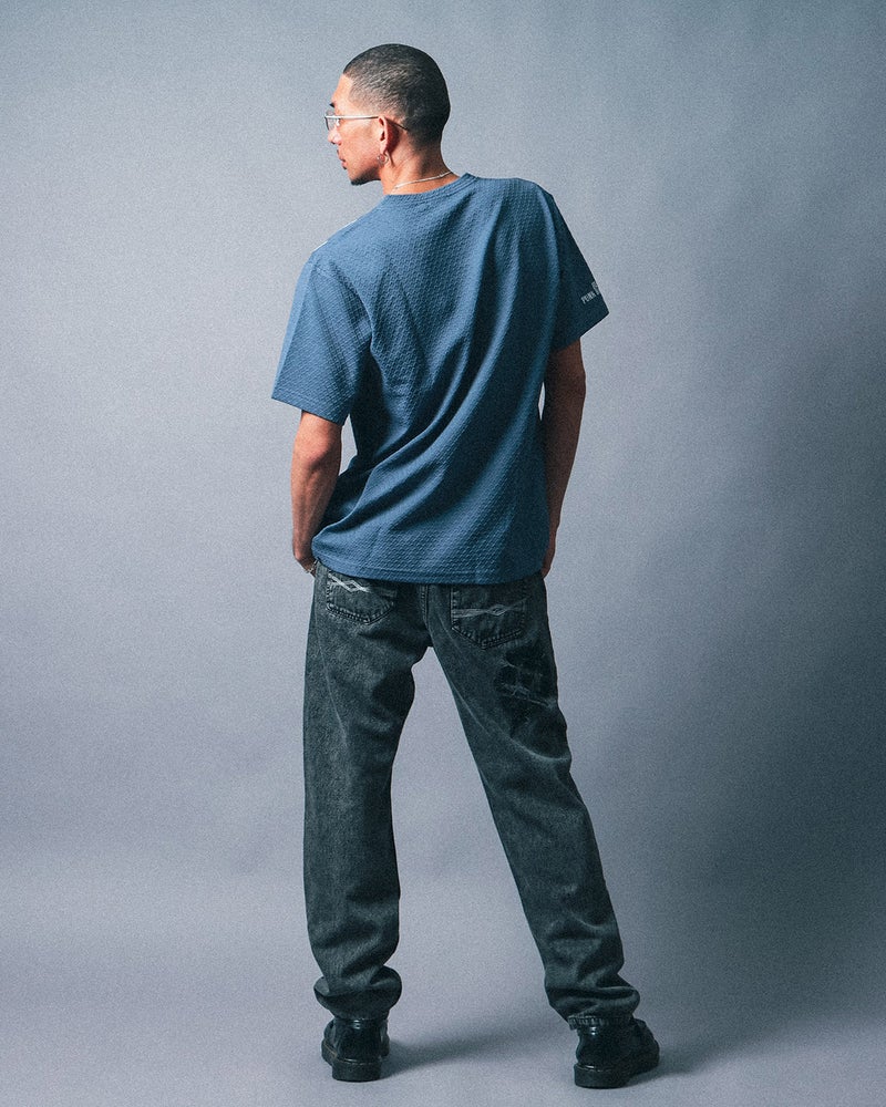 ムラ ケミカルブリーチ デニムパンツ